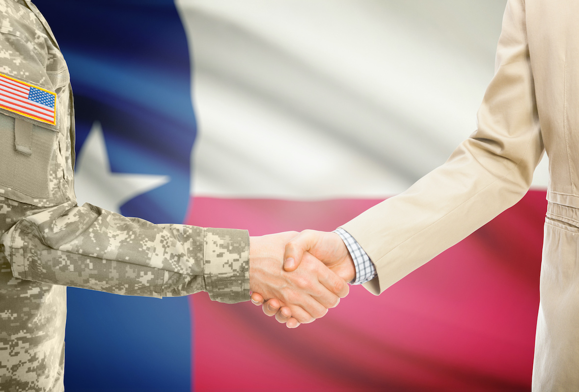 USA military man in uniform and civil man in suit shaking hands with certain USA state flag on background - Texas