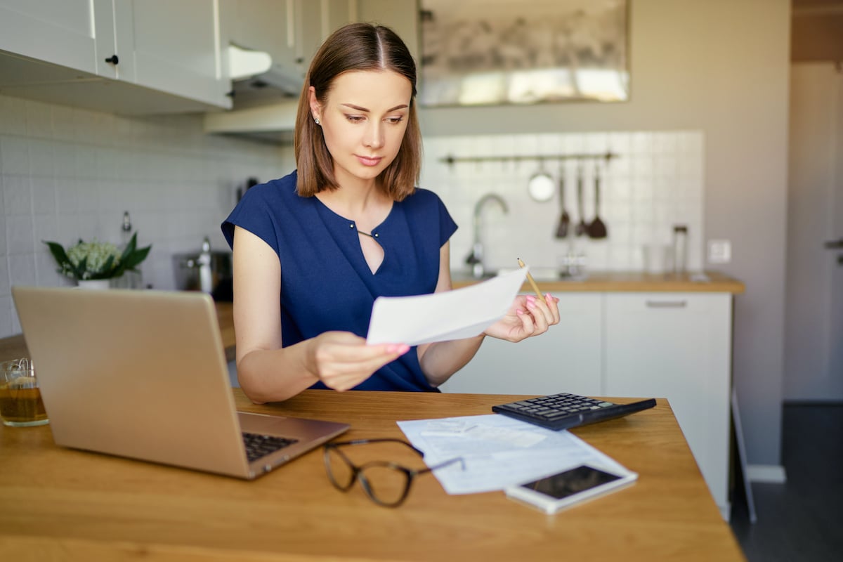 texas investor reviewing her financial plan at her kitchen table